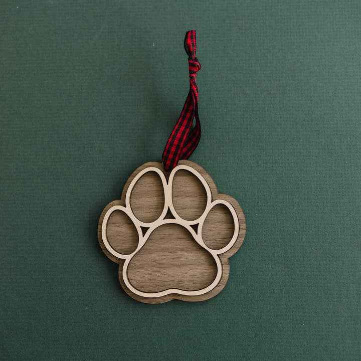 Dog Paw Christmas Ornament in Walnut by Woodlander Workshop